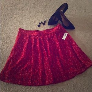 New with tags.  Red skirt with floral design.